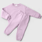 Remy & Co. Lilac embroidered crewneck sweatshirt and matching joggers laid flat.