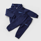 Remy & Co. Navy Blue Puff Print Hoodie Tracksuit Set with matching joggers laid flat.