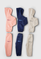 Remy & Co. Puff Print Hoodie Tracksuit Sets in Pink, Navy Blue and Light Grey.